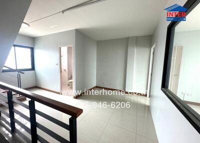 Spacious bedroom with ample natural light and balcony access