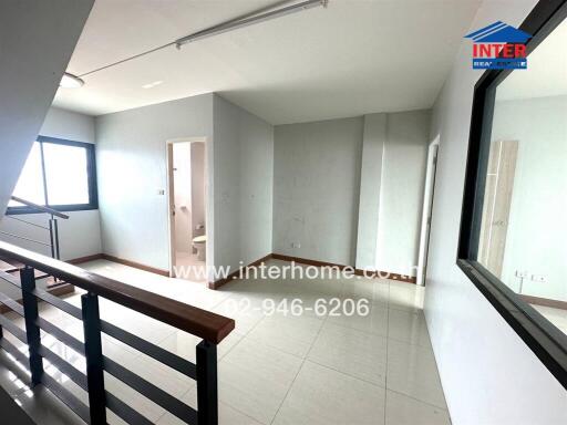 Spacious bedroom with ample natural light and balcony access