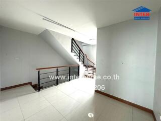 Bright and spacious hallway with staircase