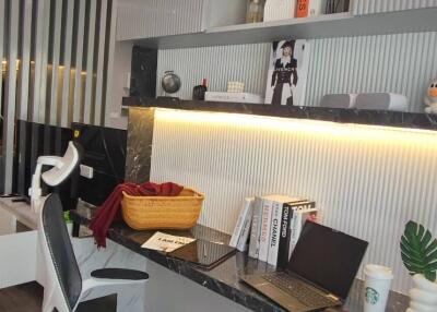 Modern home office with elegant shelving and stylish desk chair