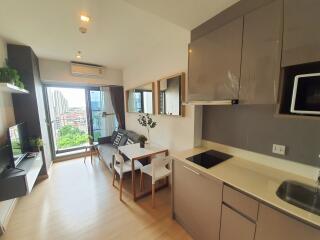 Modern kitchen with dining area and bright natural light