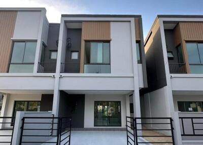 Modern double-storey residential townhouses with balconies