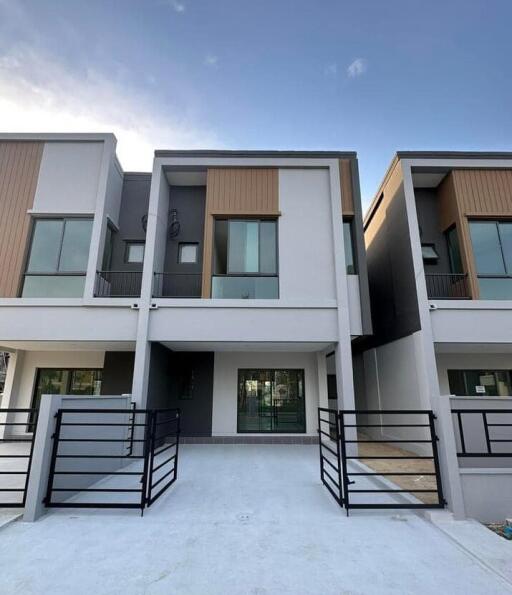 Modern double-storey residential townhouses with balconies