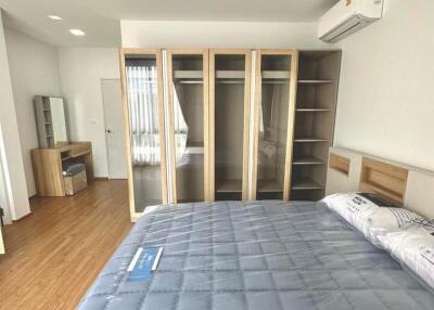 Spacious bedroom with large bed and built-in wardrobes