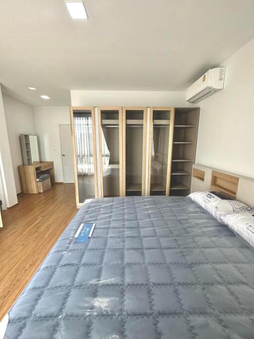 Spacious bedroom with large bed and built-in wardrobes