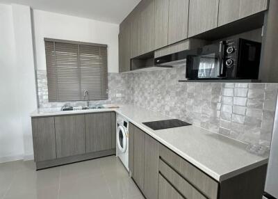 Modern kitchen with updated appliances and sleek cabinetry