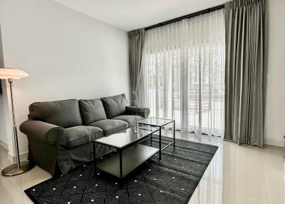 Modern minimalist living room with large windows and stylish decor