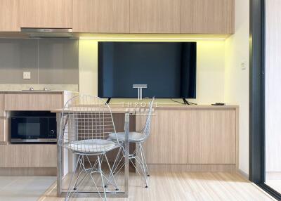 Modern kitchen with integrated appliances and minimalist furniture