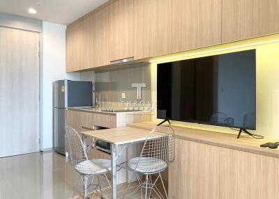 Modern kitchen with dining area and built-in appliances