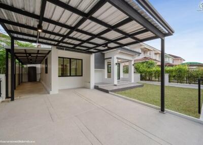 Spacious covered patio with sleek flooring and modern design