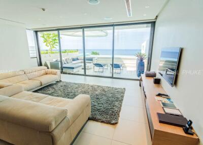 Modern living room with ocean view and access to outdoor terrace