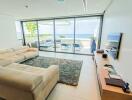 Modern living room with ocean view and access to outdoor terrace