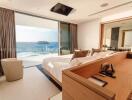 Spacious bedroom with ocean view through large glass window