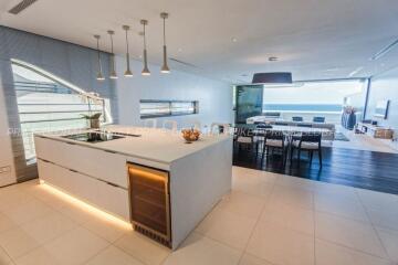 Modern kitchen with integrated dining area and ocean view