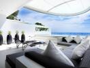 Modern outdoor lounge area with ocean view and plush seating