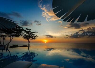 Luxurious outdoor infinity pool overlooking sunset