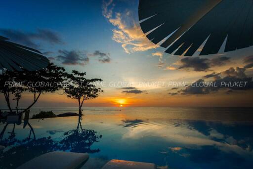 Luxurious outdoor infinity pool overlooking sunset