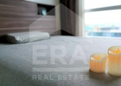 Cozy bedroom interior with candles and city view