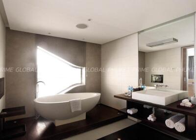 Modern bathroom with freestanding bathtub and natural light