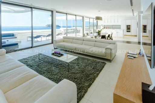 Spacious modern living room with ocean view and open plan layout