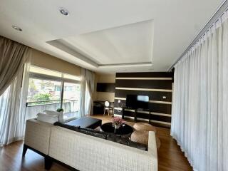 Spacious and modern living room with ample natural light