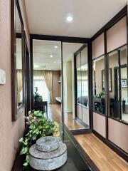 Elegant hallway interior with decorative elements leading to a brightly lit room