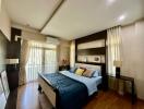 Elegant and cozy bedroom with modern decor and ample natural light