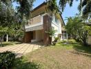 Spacious two-story house with large garden and veranda