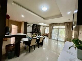 Spacious and well-lit living room with dining area