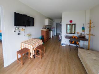 Spacious and bright living room with open kitchen layout