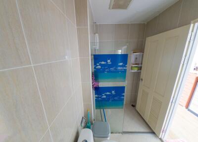 Spacious modern bathroom with decorative shower partition