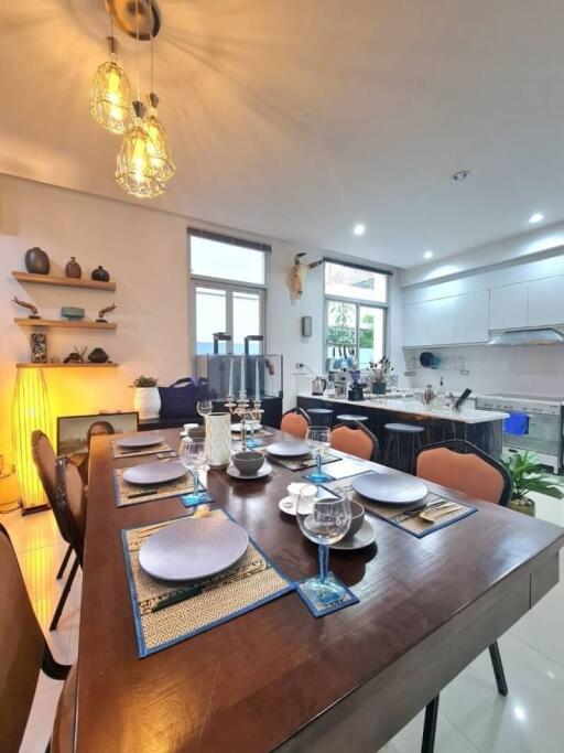 Spacious and well-lit kitchen with dining area