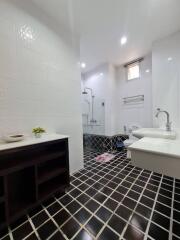 Modern and bright bathroom with stylish black and white tiling