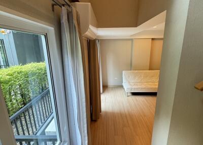 Spacious bedroom with ample natural light and balcony access