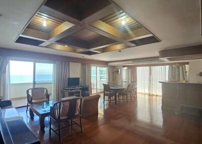 Spacious living room with large windows and ocean view