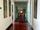 Elegant hallway with hardwood floors and decorative art