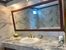 Elegant bathroom with marble walls and modern amenities