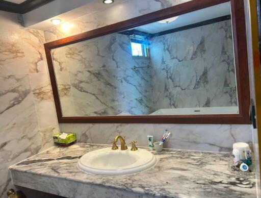 Elegant bathroom with marble walls and modern amenities