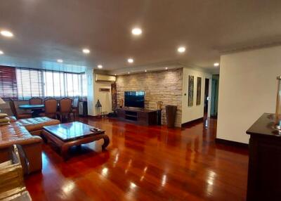 Spacious living room with polished hardwood floors and contemporary design