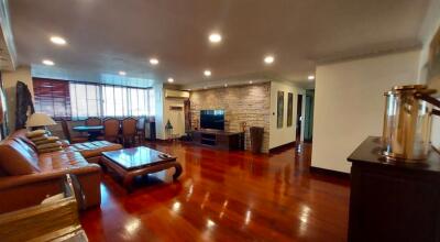 Spacious living room with polished hardwood floors and contemporary design