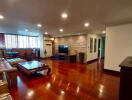 Spacious living room with polished hardwood floors and contemporary design