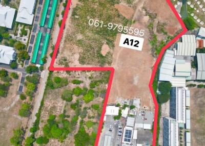 Aerial view of a vacant land parcel outlined in red