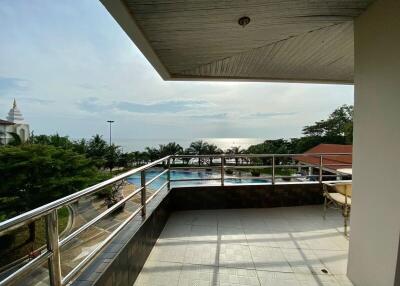 Spacious balcony with ocean view and pool access