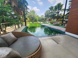 Outdoor area with pool and garden