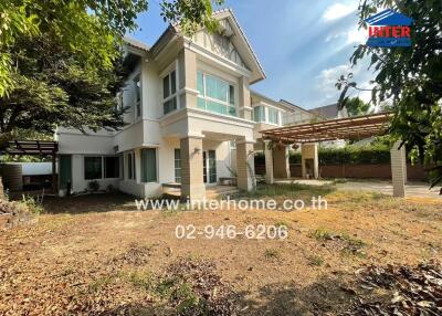 Two-story house with spacious yard and carport