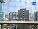 View from a balcony with high-rise buildings in the background