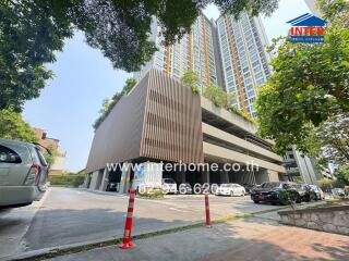 Parking area and exterior view of a high-rise residential building