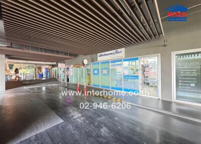 Building lobby or common area featuring commercial spaces
