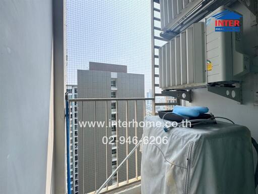 View of a high-rise building from a balcony with air conditioning units