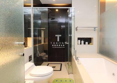 Modern bathroom with glass shower and bathtub